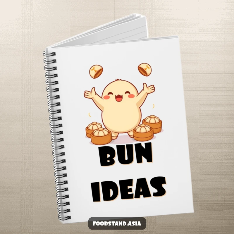Funny notebook featuring a jubilant dumpling juggling small steamed buns, ideal for jotting notes with a humorous food theme.